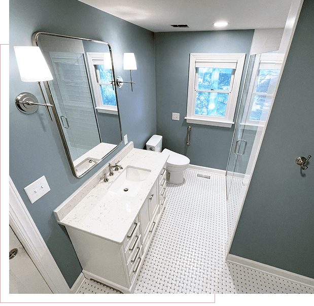 Modern bathroom with white vanity and large mirror.