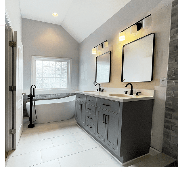 Modern bathroom with tub and double vanity.