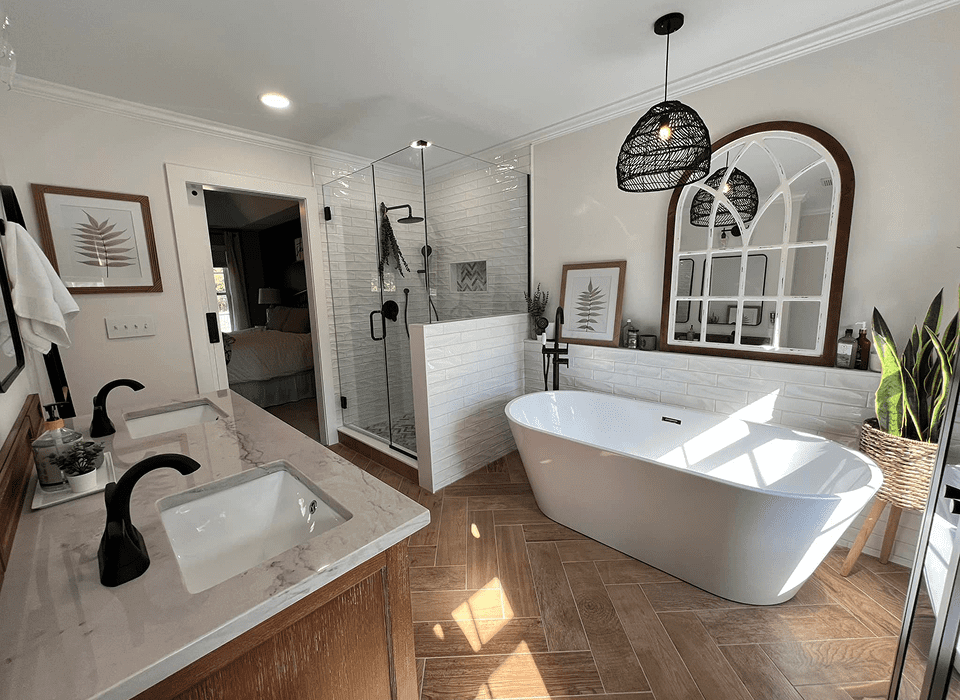 Modern bathroom with tub and glass shower.
